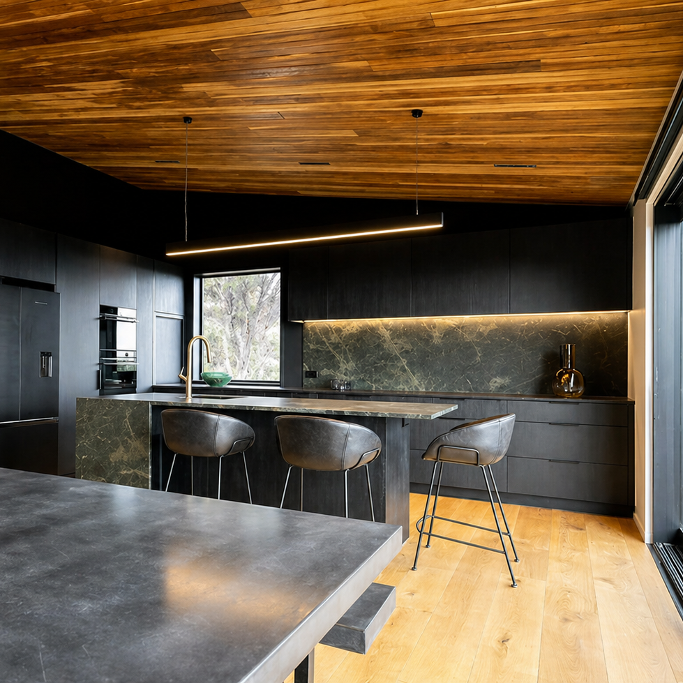 Modern kitchen with wooden ceiling, black countertops, and marble backsplash. 240cm linear light over the top in warm white