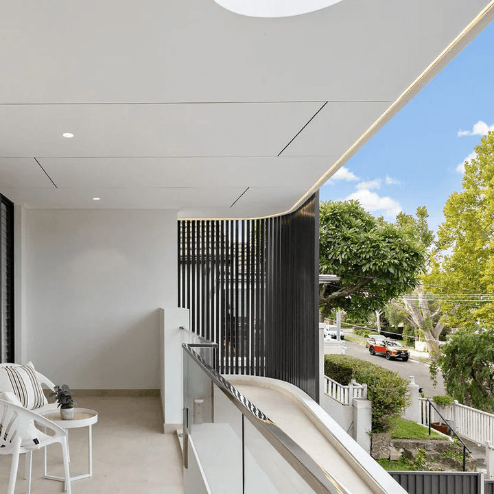 Modern interior with a view of a residential street and greenery