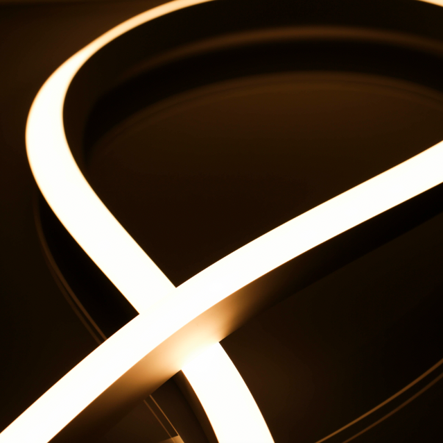 Close-up of a curved LED light strip on a dark background