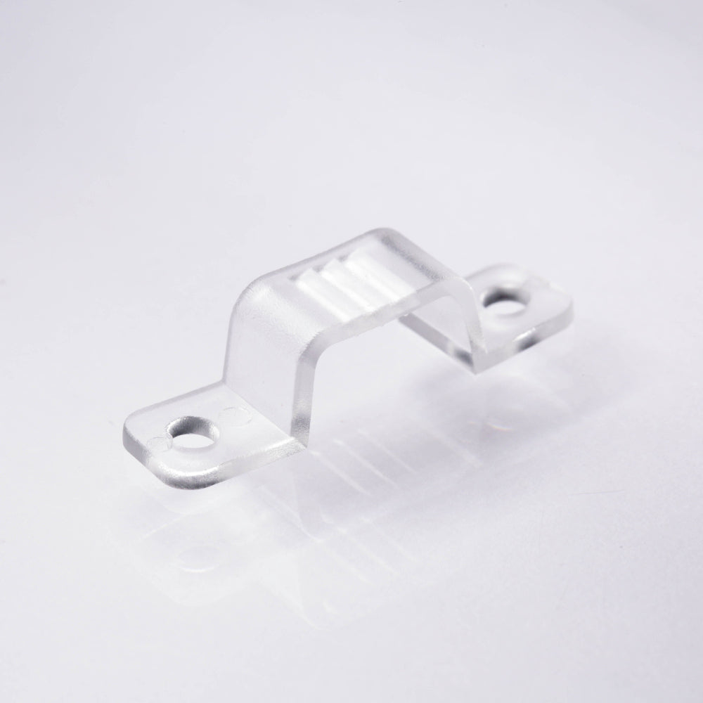 Clear plastic clip on a light gray background